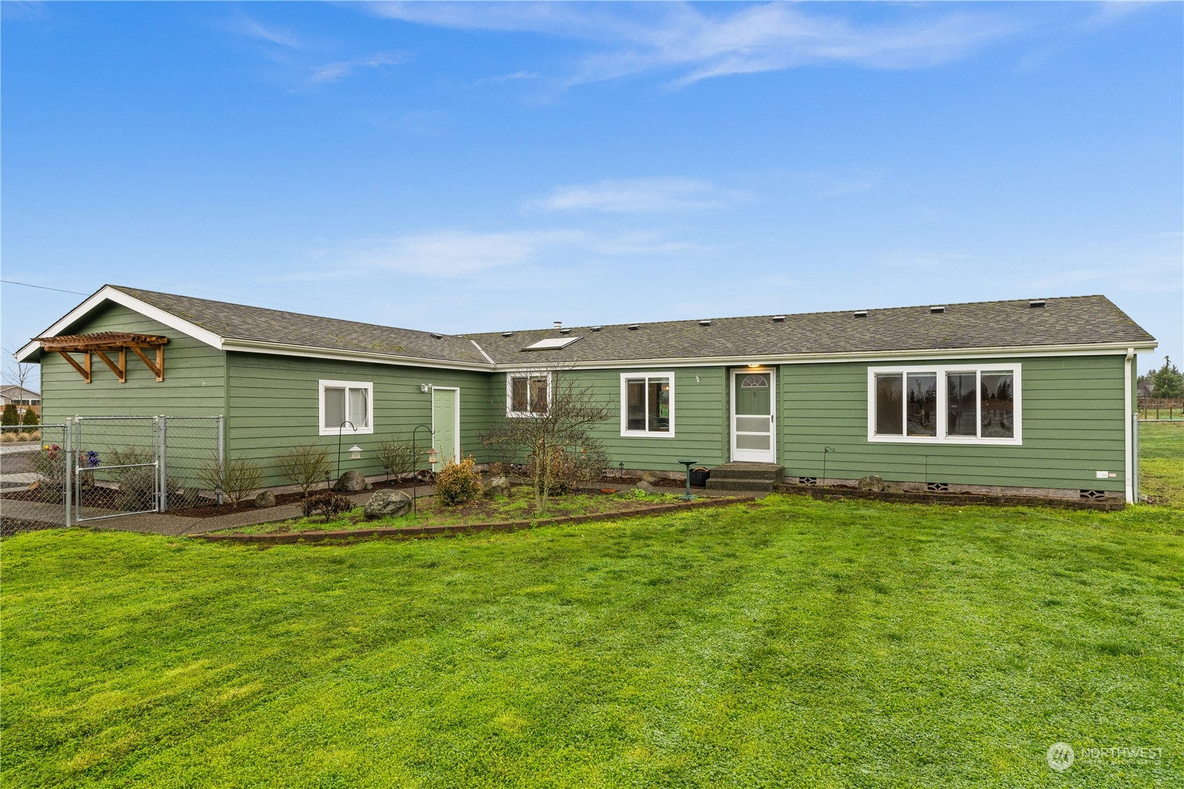 901 West Hendrickson Road Sequim, WA 98382 - Photo 2 of 39 a front view of house with yard