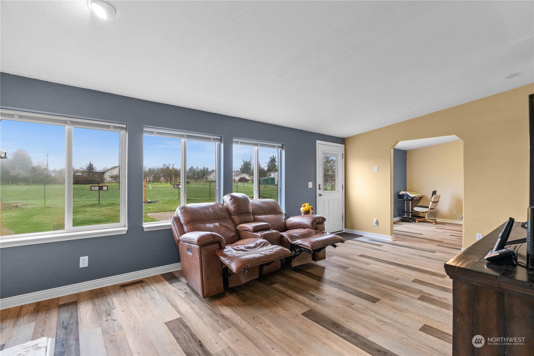 901 West Hendrickson Road Sequim, WA 98382 - Photo 22 of 39 a living room with furniture and a wooden floor