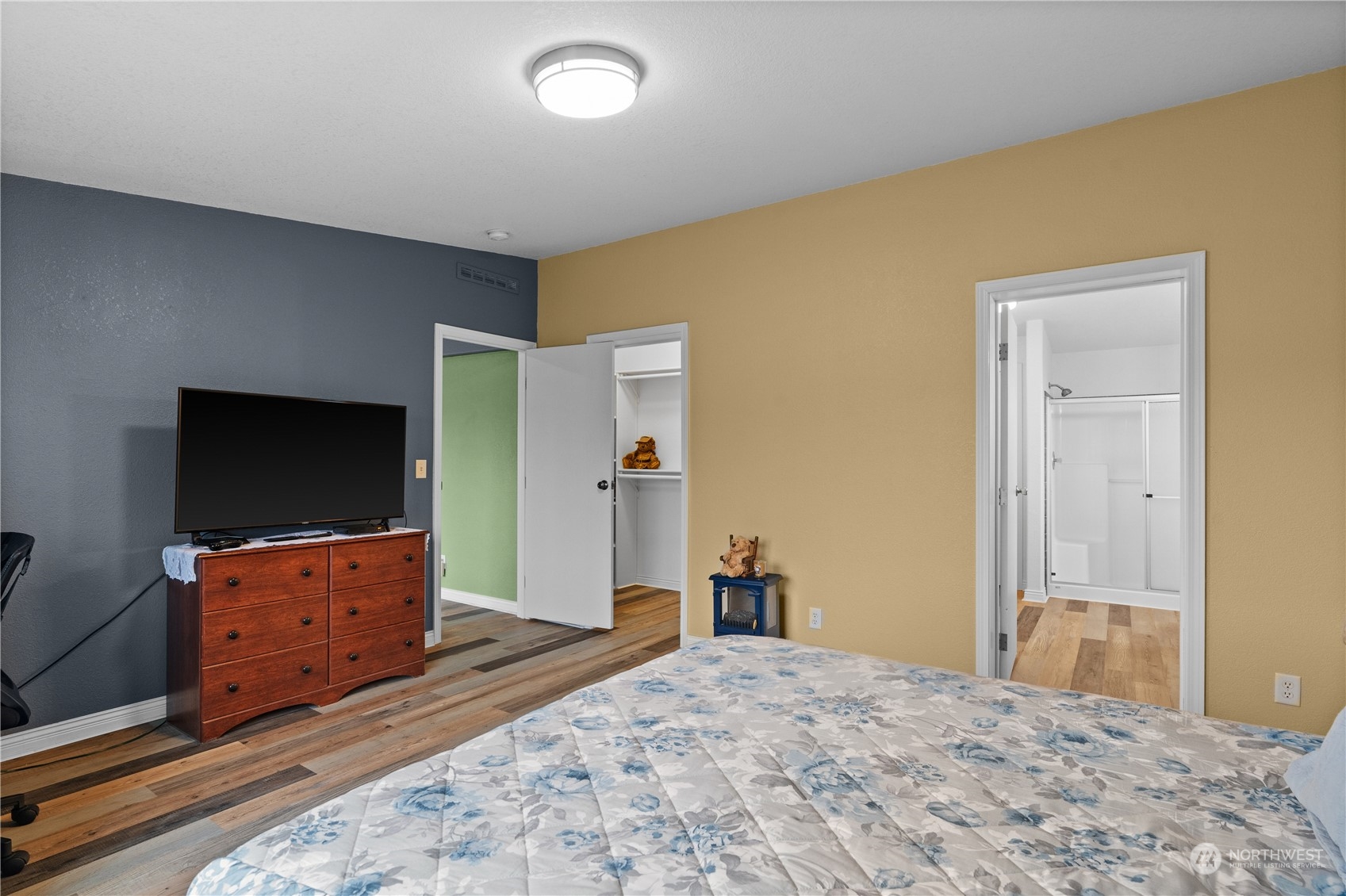 901 West Hendrickson Road Sequim, WA 98382 - Photo 25 of 39 a bedroom with a bed and television