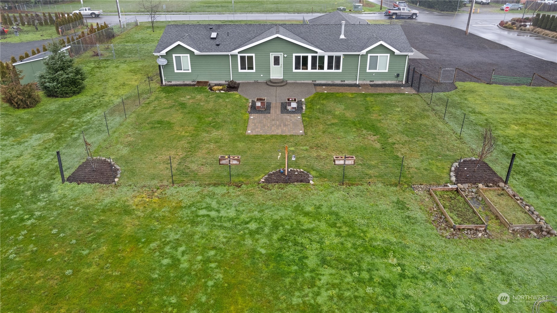 901 West Hendrickson Road Sequim, WA 98382 - Photo 36 of 39 a aerial view of a house with a yard and lake view
