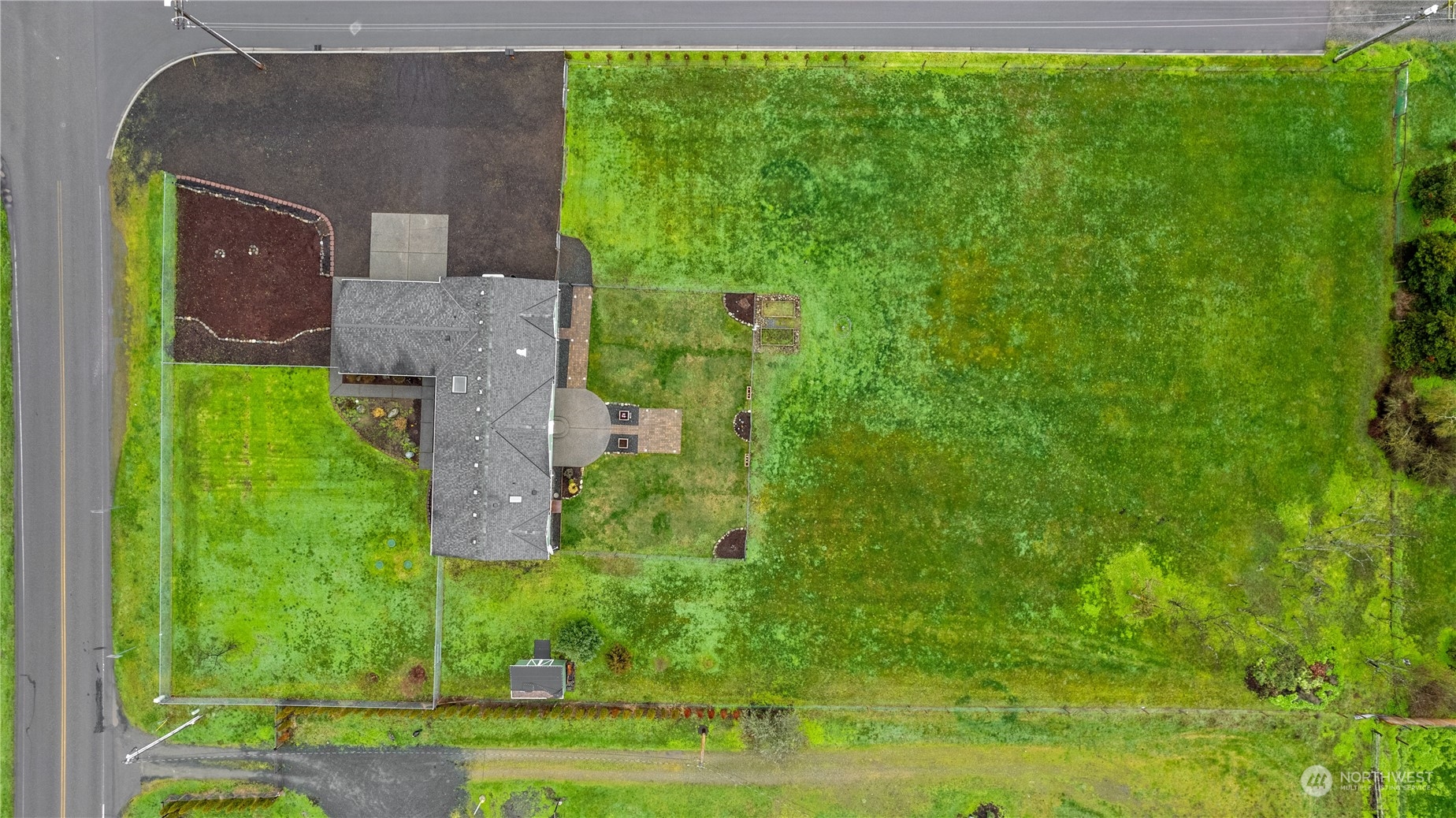 901 West Hendrickson Road Sequim, WA 98382 - Photo 39 of 39 an aerial view of a house with a yard