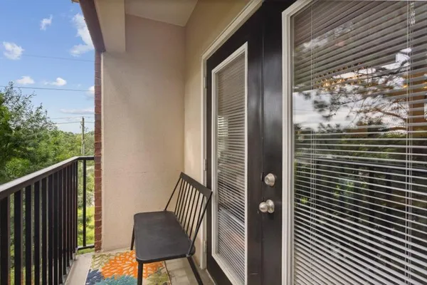 a front view of a house with a yard table and chairs