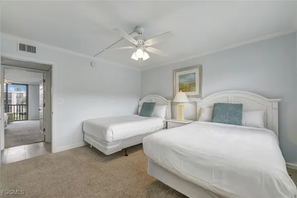 a bedroom with a large bed and a large window