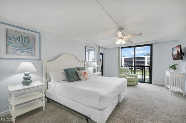 a bed room with a bed and a chandelier