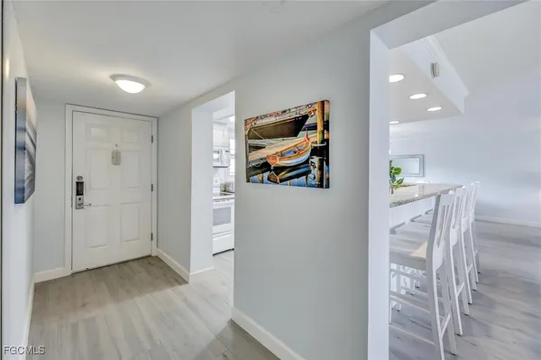 a kitchen with granite countertop a sink and cabinets