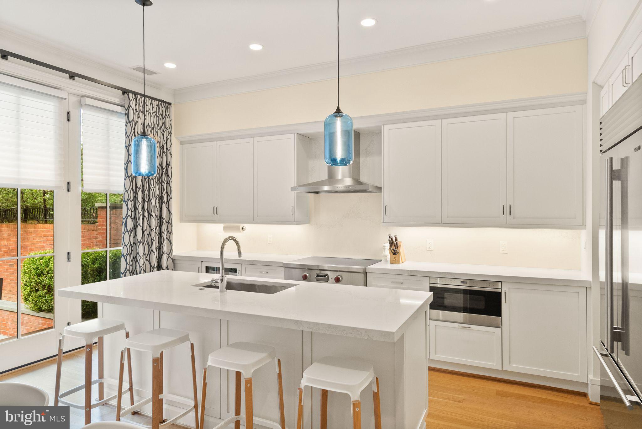 424 3rd Street Northeast Washington, DC 20002 - Photo 13 of 33 a kitchen with stainless steel appliances a sink a stove a refrigerator and cabinets