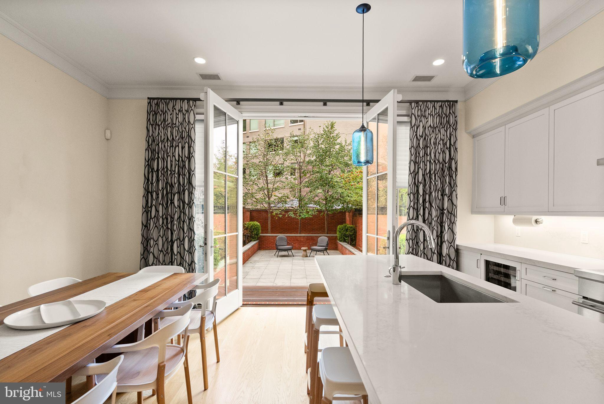 424 3rd Street Northeast Washington, DC 20002 - Photo 14 of 33 a kitchen with a sink a counter top space and living room view
