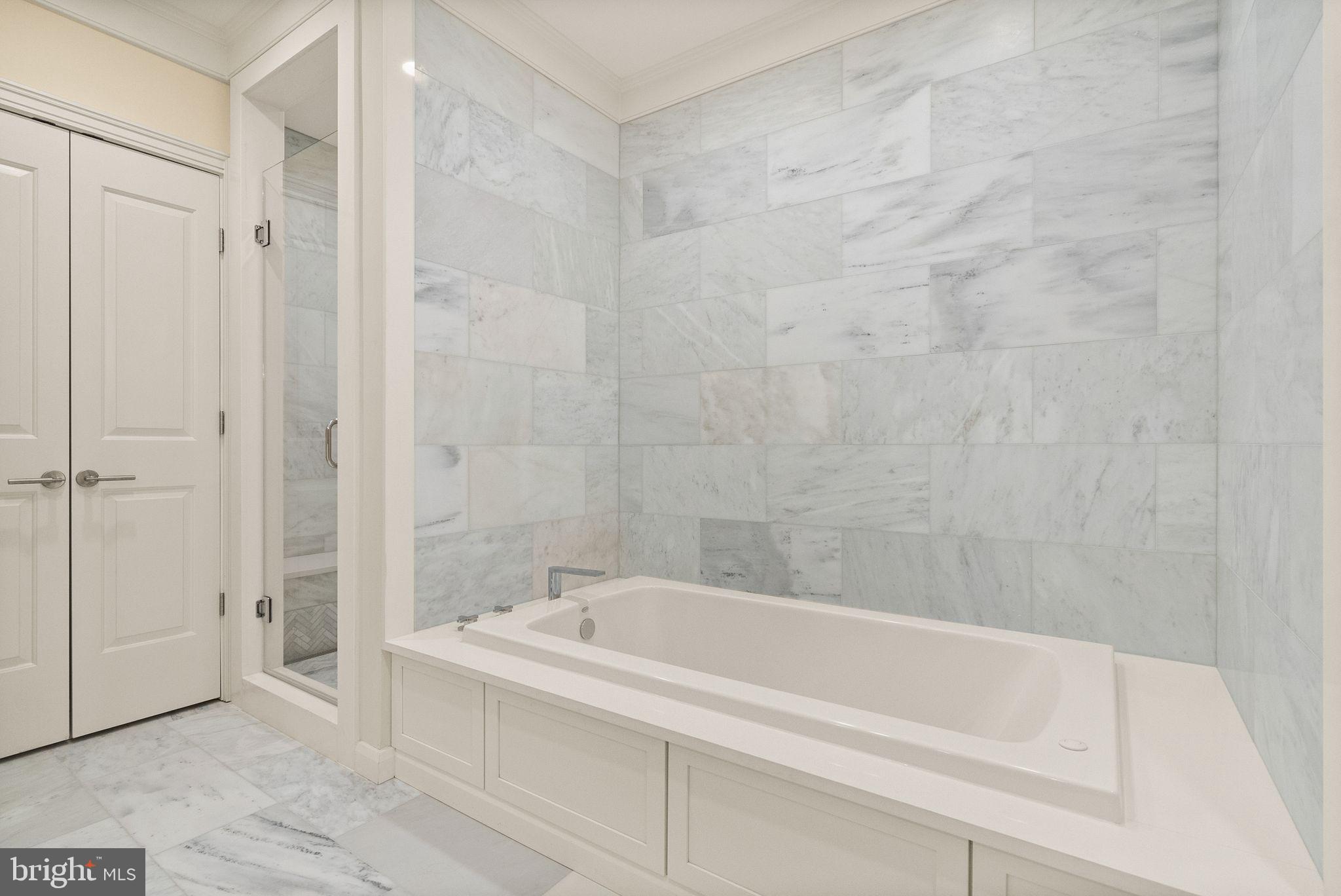 424 3rd Street Northeast Washington, DC 20002 - Photo 21 of 33 a white bath tub sitting next to a white sink and vanity