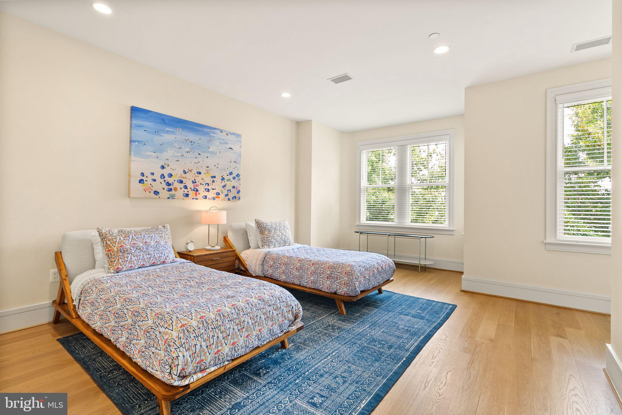 424 3rd Street Northeast Washington, DC 20002 - Photo 22 of 33 a bedroom with two beds and a window