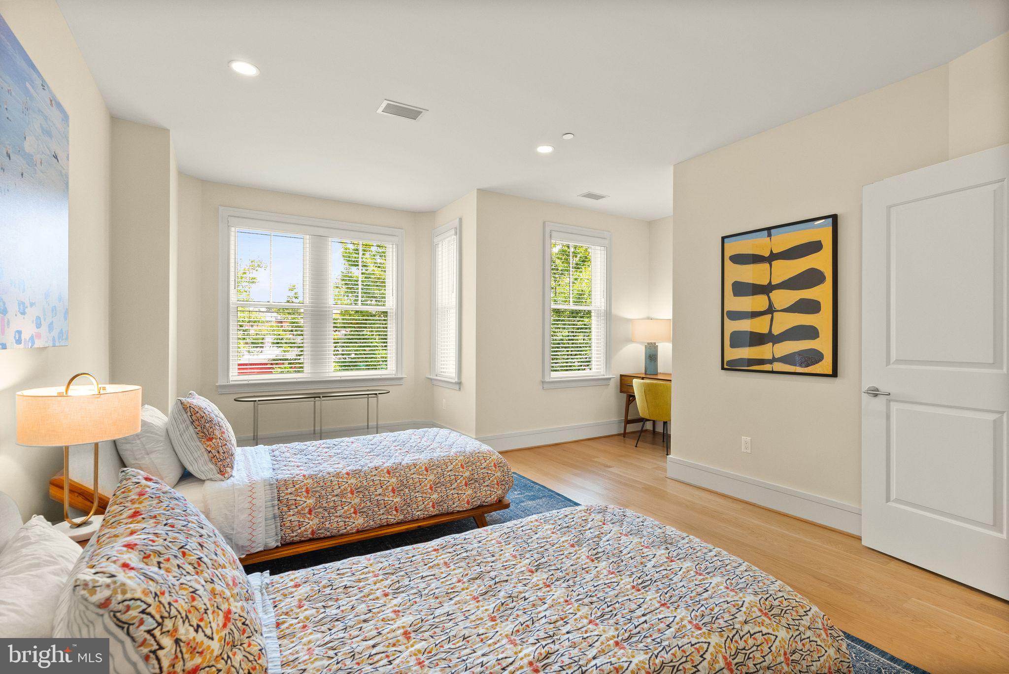 424 3rd Street Northeast Washington, DC 20002 - Photo 23 of 33 a bedroom with a bed and wooden floor