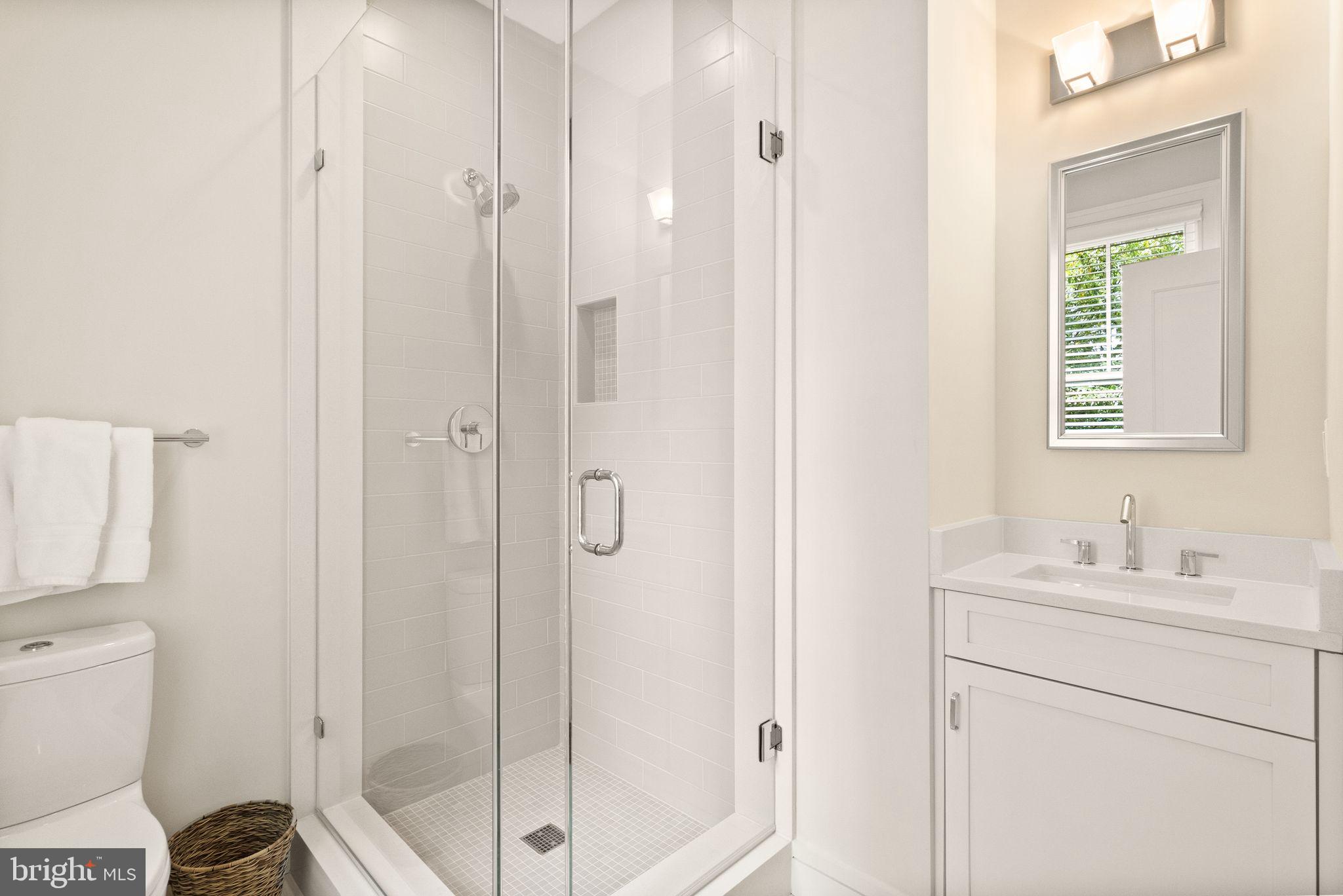 424 3rd Street Northeast Washington, DC 20002 - Photo 27 of 33 a bathroom with a toilet sink vanity and shower
