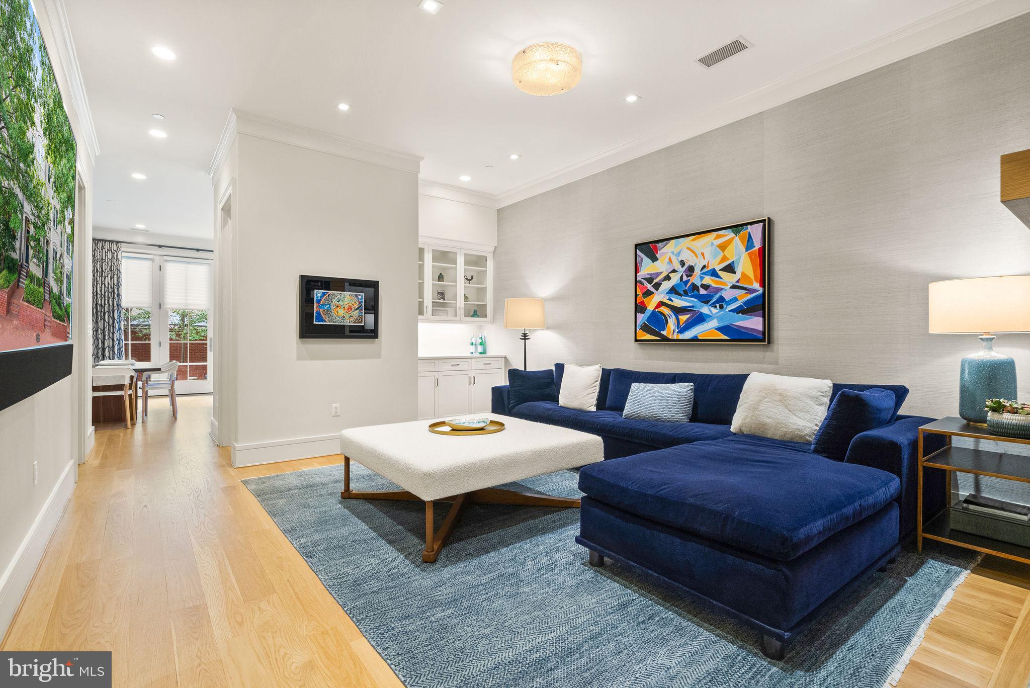 424 3rd Street Northeast Washington, DC 20002 - Photo 7 of 33 a living room with furniture a rug and a flat screen tv