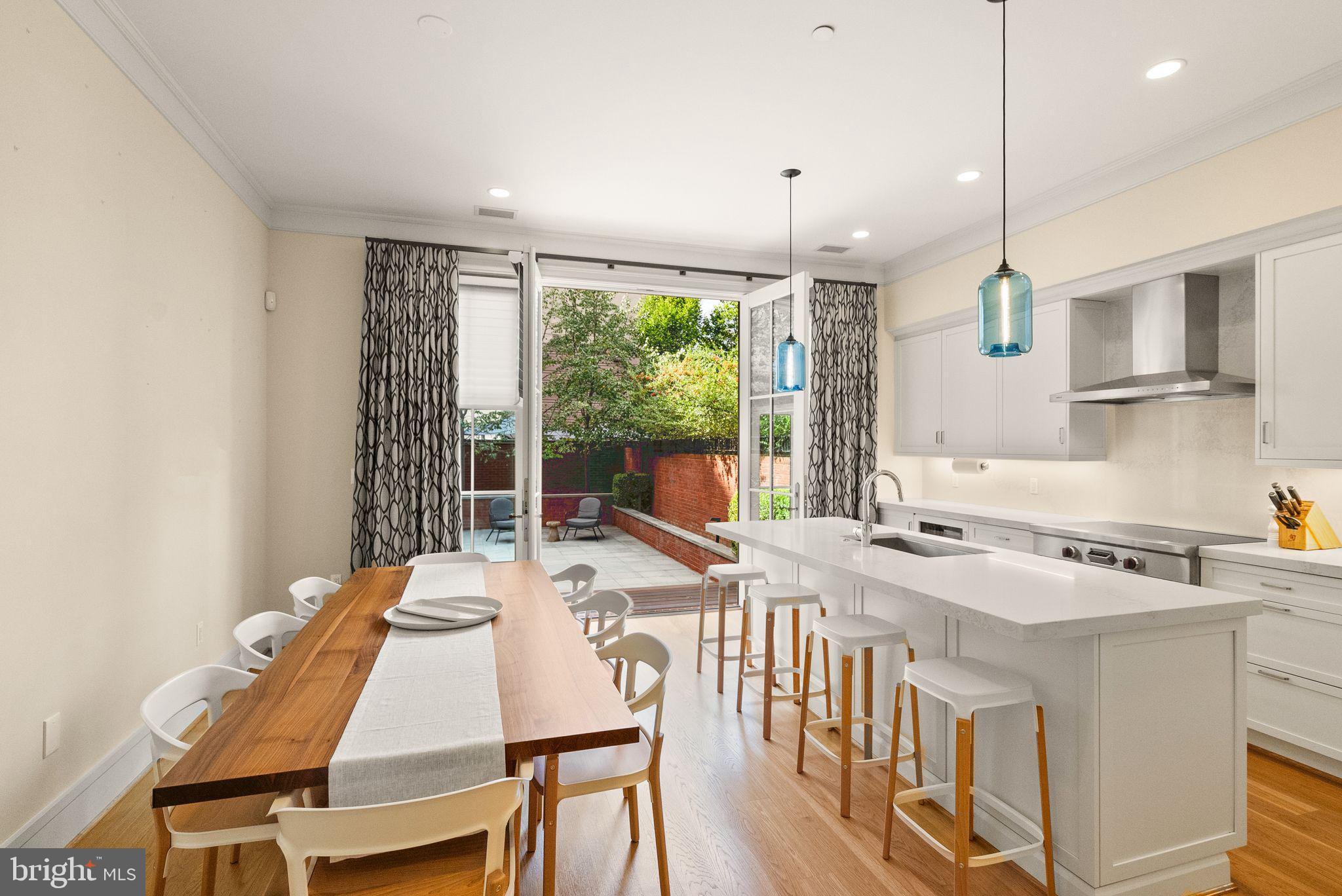424 3rd Street Northeast Washington, DC 20002 - Photo 8 of 33 a kitchen that has a stove a table and chairs in it