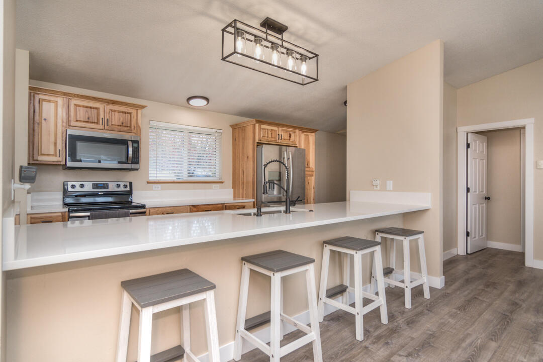 21020 Southwest Gift Road Bend, OR 97703 - Photo 17 of 51 New hickory cabinets and quartz countertops!