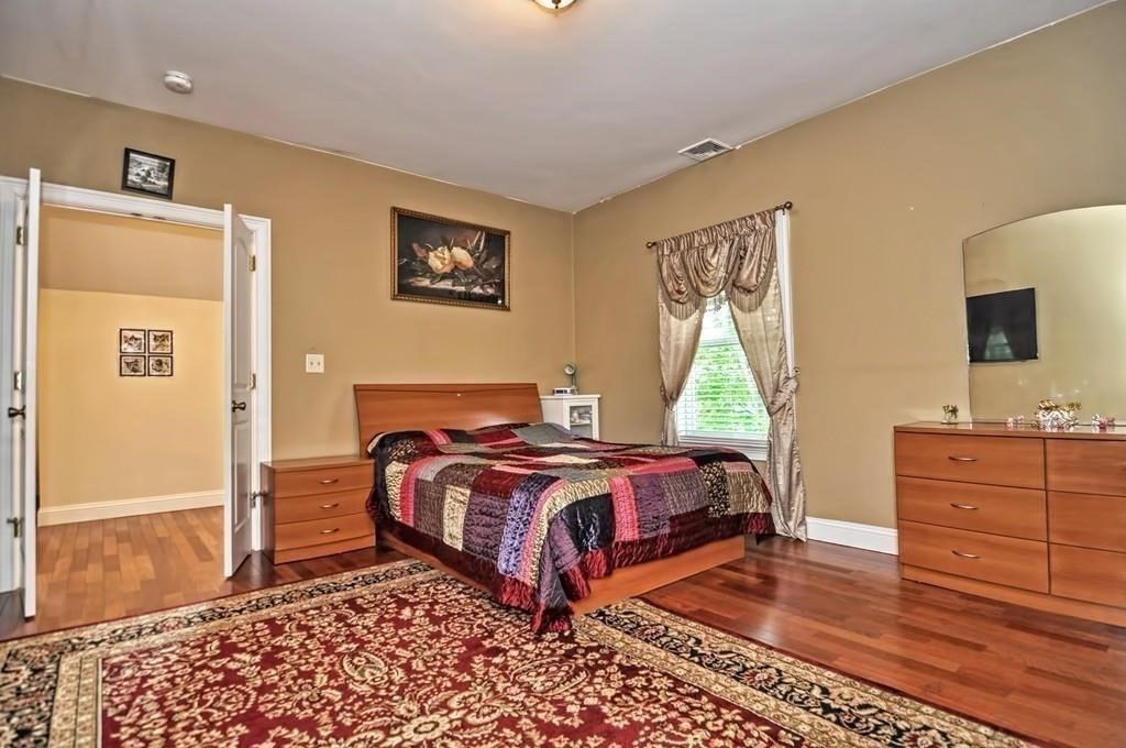 41 Webber Street, Unit 1 Malden, MA 02148 - Photo 12 of 22 a bedroom with a bed and a window