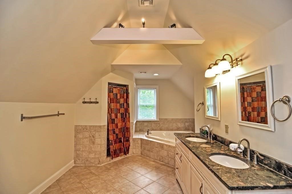 41 Webber Street, Unit 1 Malden, MA 02148 - Photo 13 of 22 a bathroom with a granite countertop sink a mirror and shower