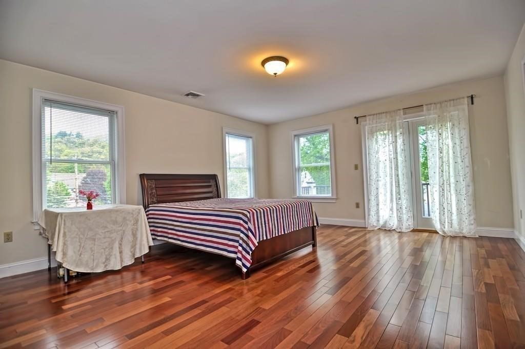 41 Webber Street, Unit 1 Malden, MA 02148 - Photo 7 of 22 a living room with furniture and wooden floor
