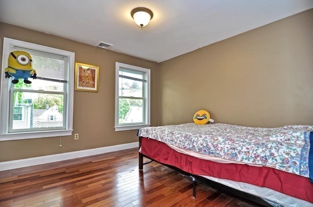 41 Webber Street, Unit 1 Malden, MA 02148 - Photo 9 of 22 a bedroom with a bed and window