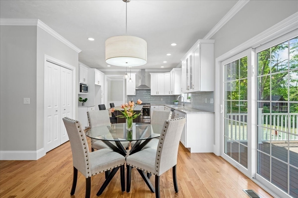 60 Sandersdale Road Charlton, MA 01507 - Photo 11 of 35 a view of a dining room with furniture a chandelier and wooden floor
