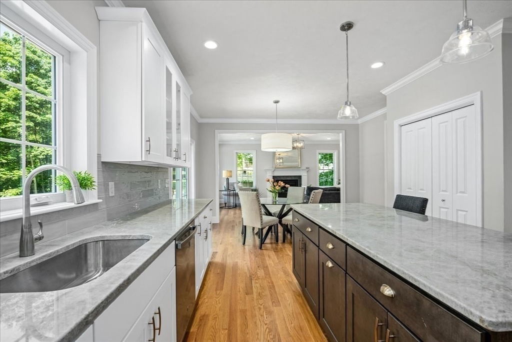 60 Sandersdale Road Charlton, MA 01507 - Photo 10 of 35 a kitchen with sink cabinets and wooden floor