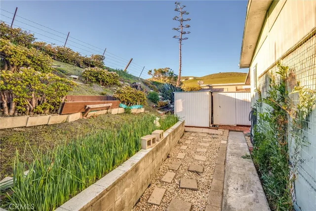 a view of a backyard of the house