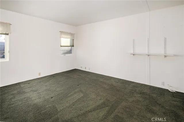 an empty room with a fan