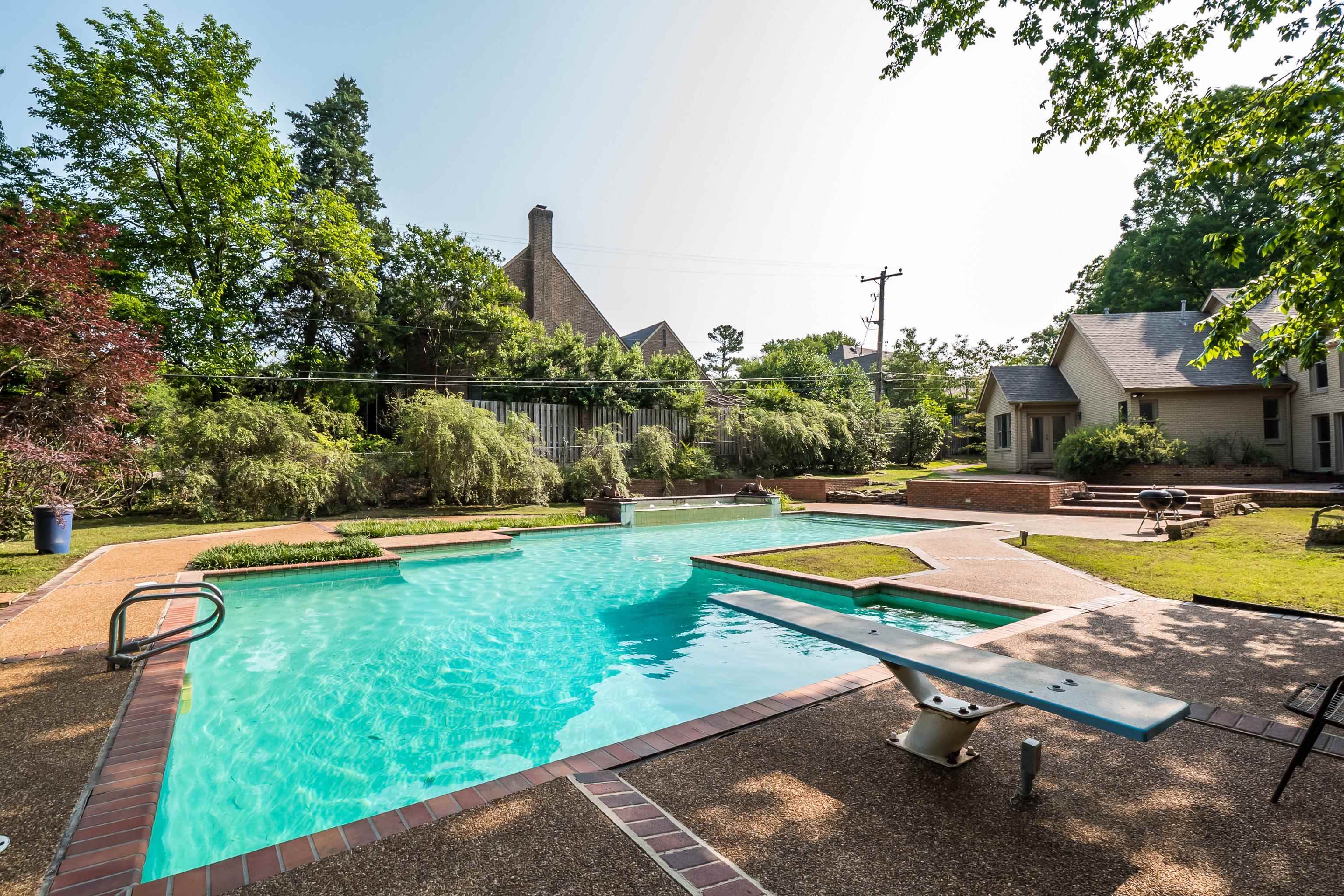 5270 Walnut Grove Road Memphis, TN 38120 - Photo 8 of 25 swimming pool with outdoor seating and yard