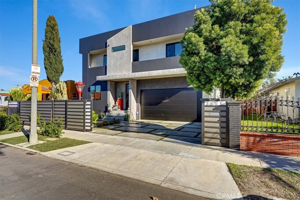 a front view of a house with garage