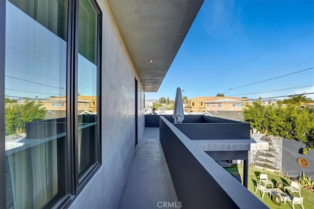 2012 South Curson Avenue Los Angeles, CA 90016 - Photo 15 of 40 a balcony with wooden floor