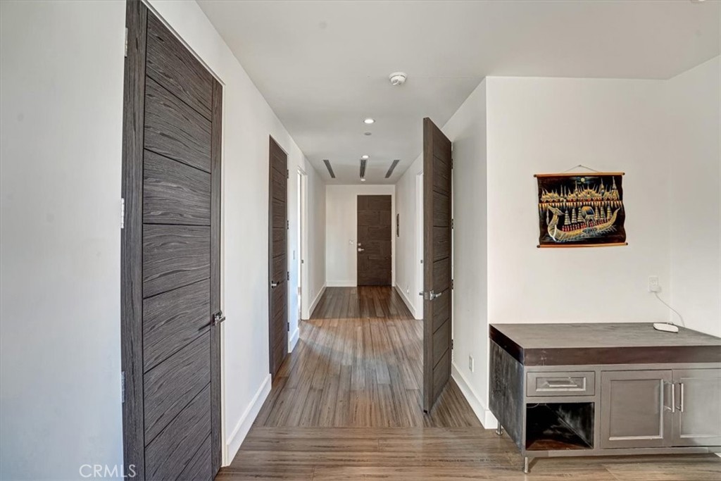 2012 South Curson Avenue Los Angeles, CA 90016 - Photo 20 of 40 a view of a hallway with wooden floor and staircase