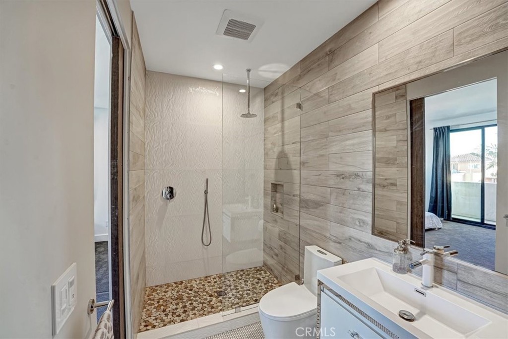 2012 South Curson Avenue Los Angeles, CA 90016 - Photo 22 of 40 a bathroom with a sink a toilet and shower