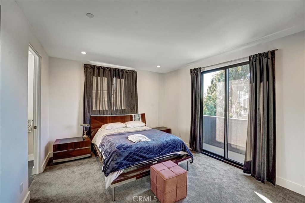 2012 South Curson Avenue Los Angeles, CA 90016 - Photo 24 of 40 a bedroom with a bed and a window