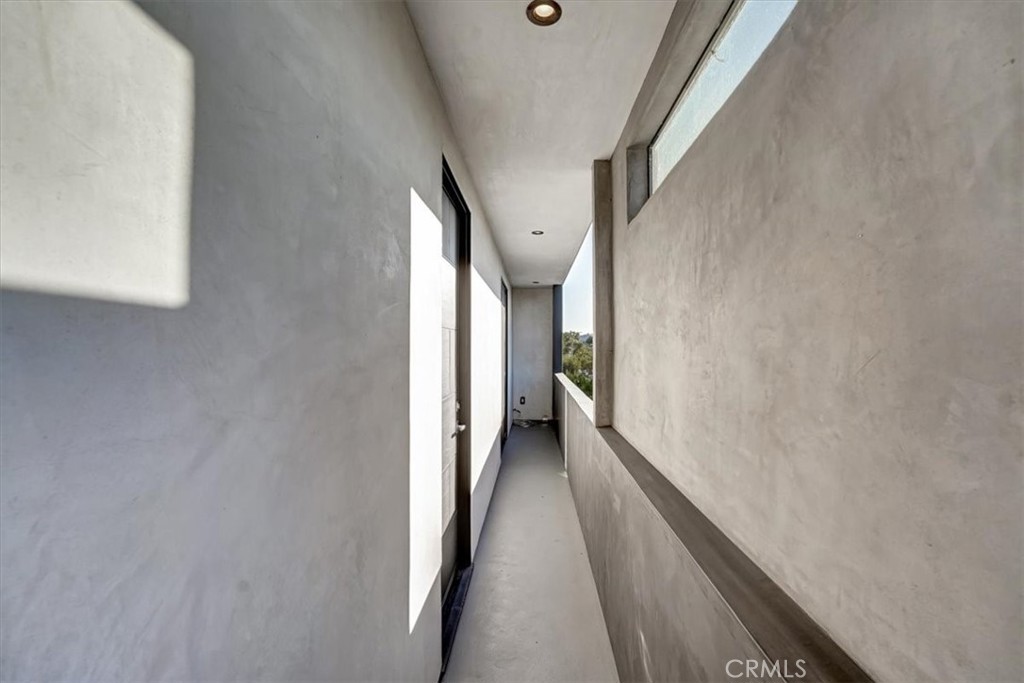 2012 South Curson Avenue Los Angeles, CA 90016 - Photo 26 of 40 a view of a hallway with wooden floor and staircase