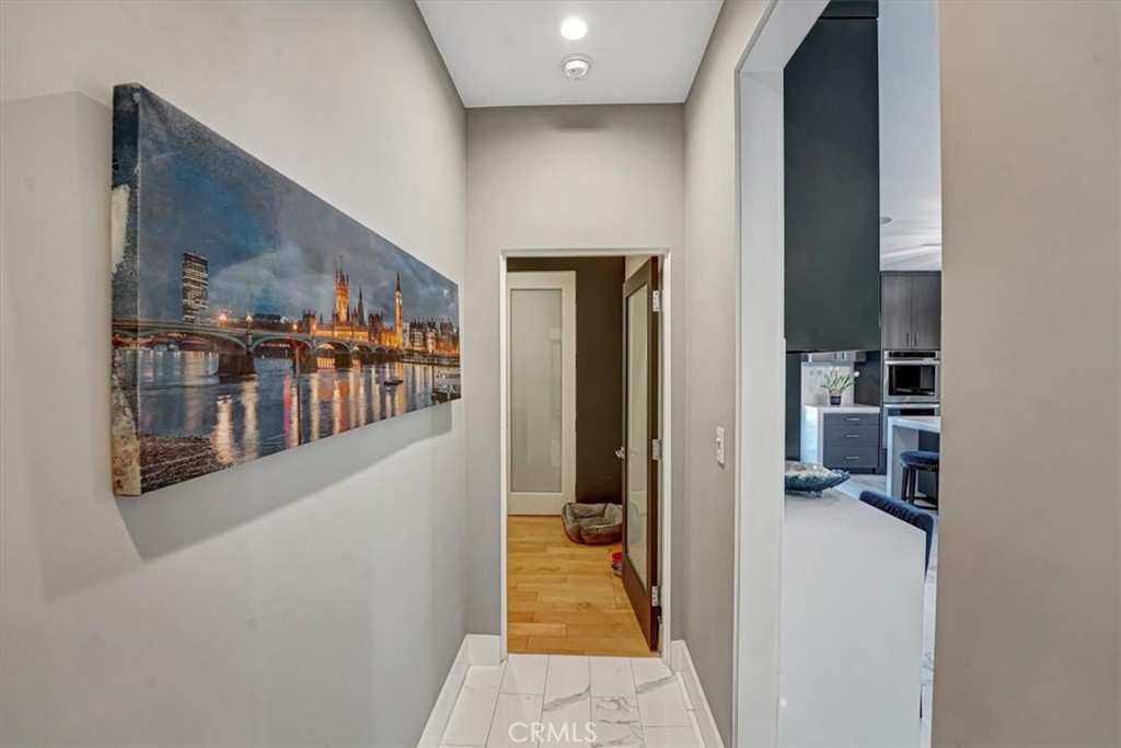2012 South Curson Avenue Los Angeles, CA 90016 - Photo 30 of 40 a hallway with dining area and chandelier