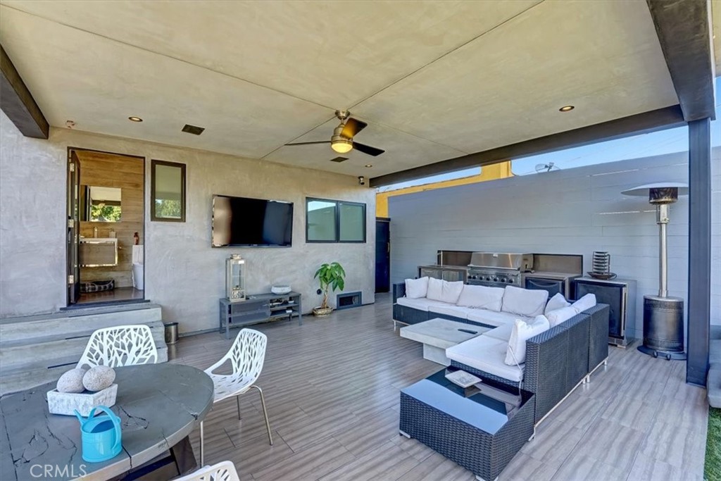 2012 South Curson Avenue Los Angeles, CA 90016 - Photo 33 of 40 a living room with furniture and a flat screen tv