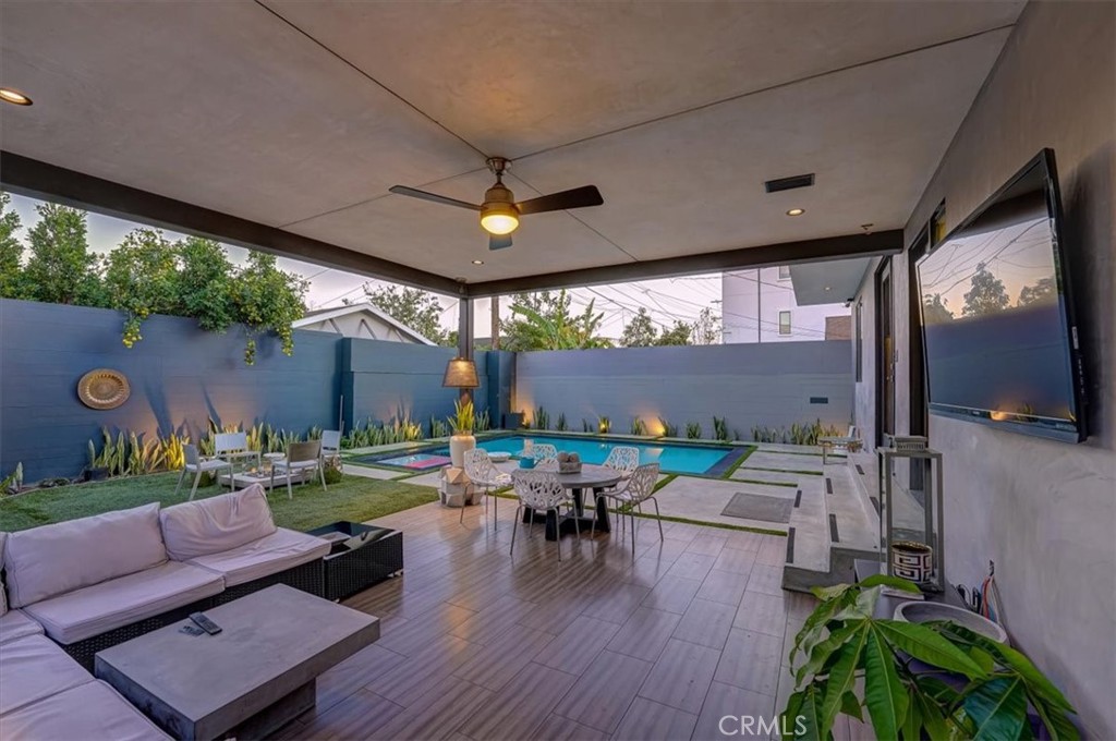 2012 South Curson Avenue Los Angeles, CA 90016 - Photo 36 of 40 a living room with patio furniture and a flat screen tv