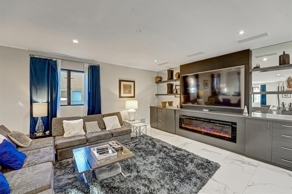 2012 South Curson Avenue Los Angeles, CA 90016 - Photo 5 of 40 a living room with furniture and a flat screen tv