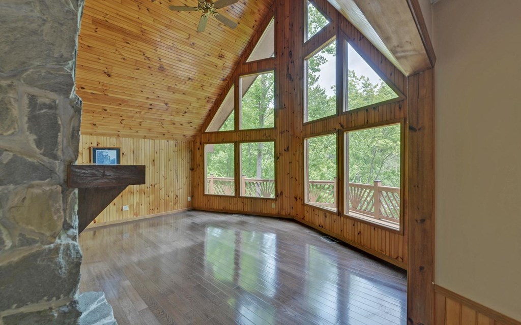 1720 Caney Creek Road Murphy, NC 28906 - Photo 14 of 69 a view of an empty room with wooden floor and a window