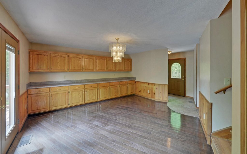 1720 Caney Creek Road Murphy, NC 28906 - Photo 19 of 69 a view of a kitchen with wooden cabinet and a fireplace
