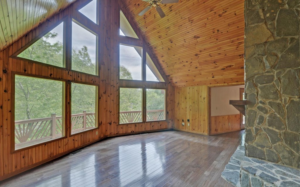 1720 Caney Creek Road Murphy, NC 28906 - Photo 3 of 69 a view of an empty room with wooden floor and windows