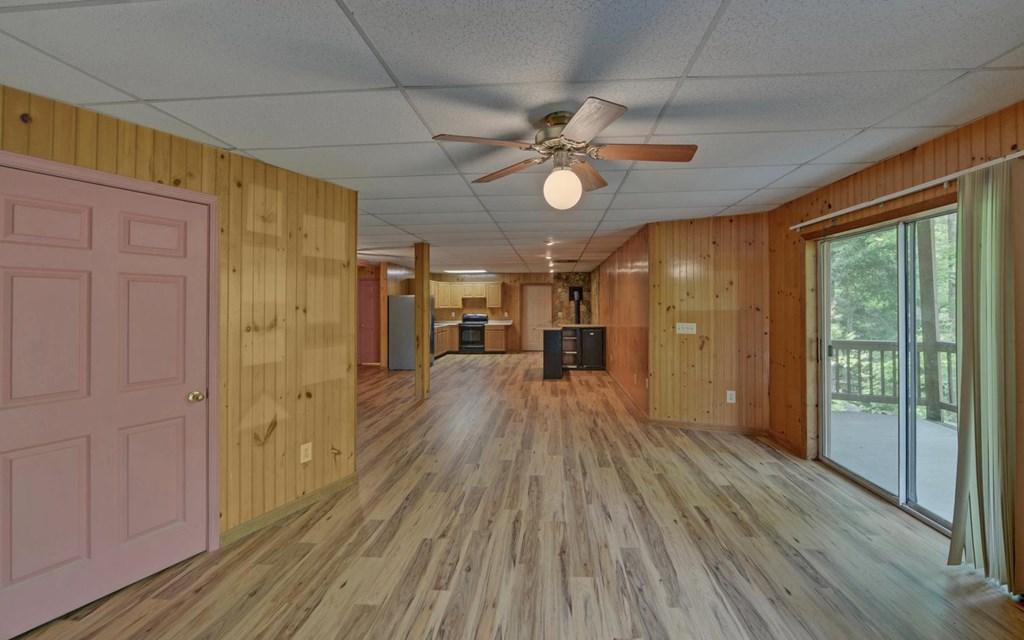 1720 Caney Creek Road Murphy, NC 28906 - Photo 32 of 69 a view of empty room with wooden floor and fan