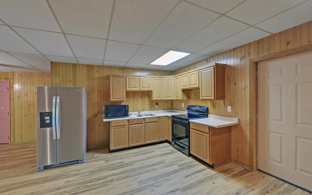 1720 Caney Creek Road Murphy, NC 28906 - Photo 37 of 69 a kitchen with stainless steel appliances a stove refrigerator sink and cabinets