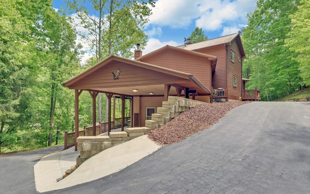 1720 Caney Creek Road Murphy, NC 28906 - Photo 45 of 69 a view of a house with backyard and sitting area