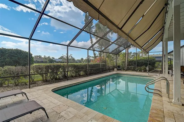 a view of a swimming pool with a porch
