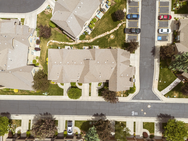 6761 950 East Midvale, UT 84047 - Photo 41 of 44 Aerial perspective showcasing multiple properties with uniform rooflines