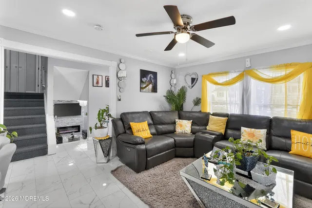a living room with furniture fireplace and a flat screen tv