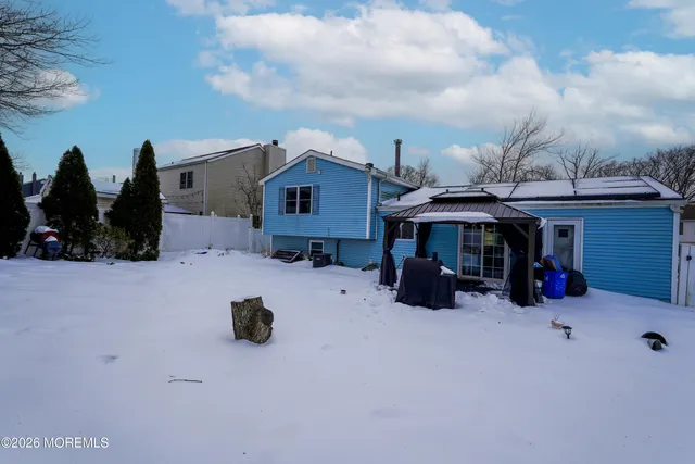 a view of the house with a yard