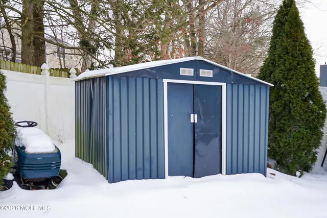 a view of open space with snow on the road