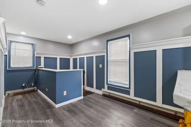 a bathroom with a toilet a sink and vanity