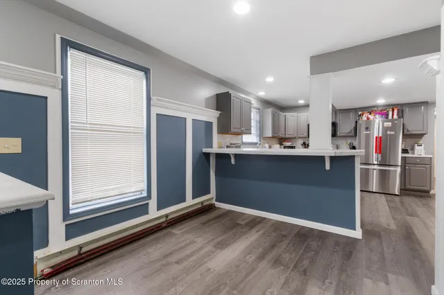 a bedroom with a bed couch and a window